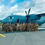 READY TO ROLL: No. 35 Squadron members from the first air mobility detachment with Papua New Guinea Defence Force personnel, stand with a C-27J Spartan at Wewak Airfield, Papua New Guinea.