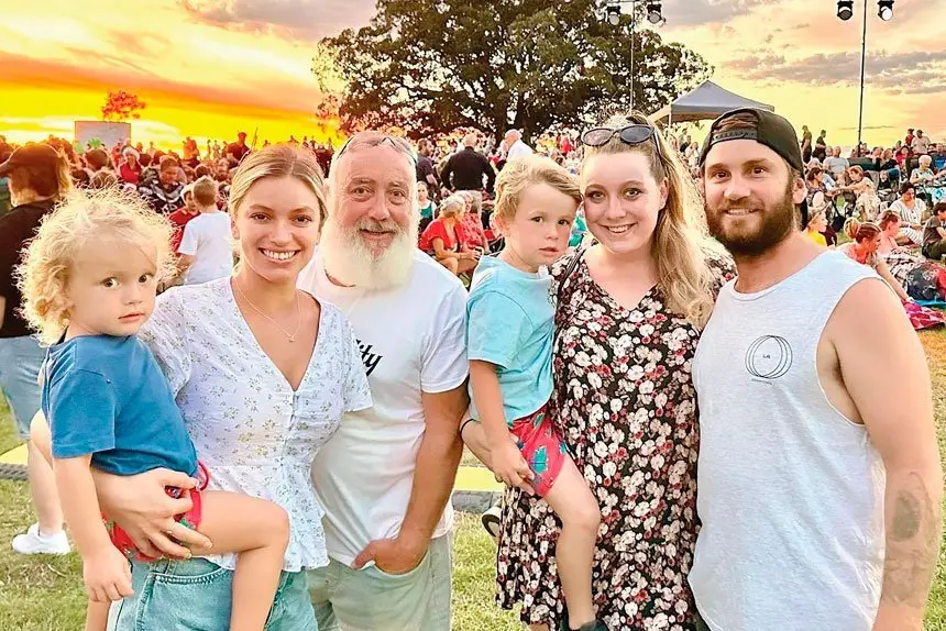 Carollers enjoy the Christmas season.
