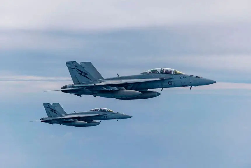 RAAF F/A - 18F Super Hornets in the air during a flying exercise last year. Photo by: AS1 Jake Hobbs