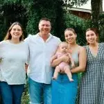 Andrew Antoniolli stands with his family.