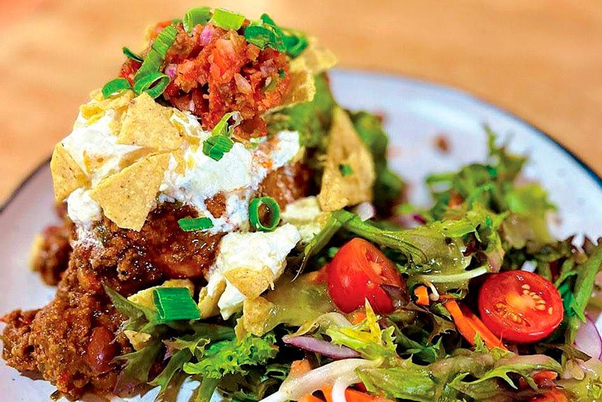 Chilli Con Carne Loaded Spud served with sour cream, guacamole, crushed corn chips, el chapo relish (salsa) and a side of house made dressed salad. $16.50