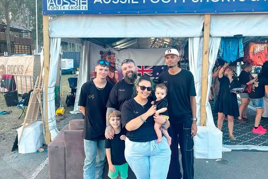 Evola with his family and barbers AJ and Jacob.