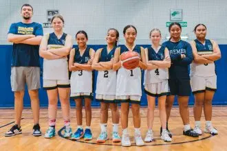 Director of Basketball James Ringholt with some of the squad members.