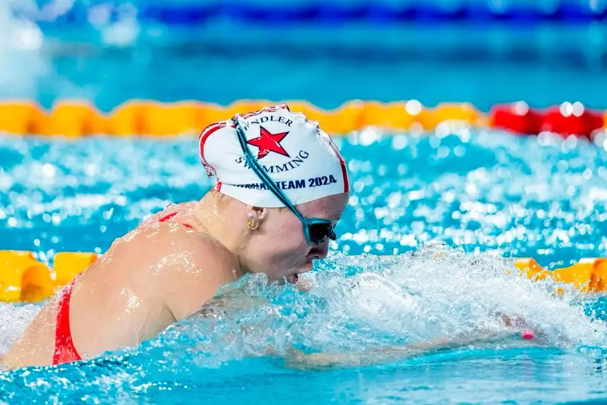 WINNERS ARE GRINNERS: Ella Ramsay and fellow young gun of the pool Abbey Connor with their passes to the Paris Games.