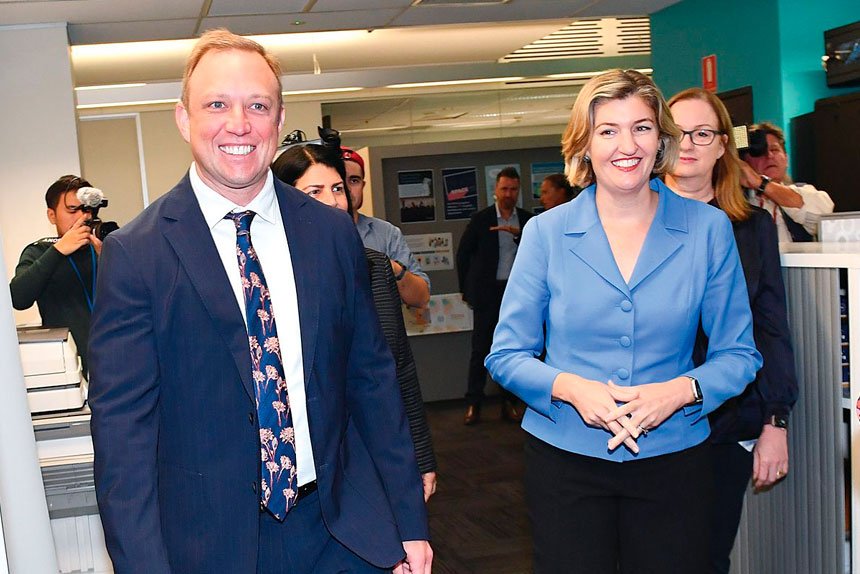 Premier Steven Miles and Health Minister Shannon Fentiman arrive to speak to media during a press conference in Brisbane.