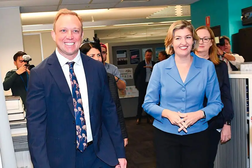 Premier Steven Miles and Health Minister Shannon Fentiman arrive to speak to media during a press conference in Brisbane.