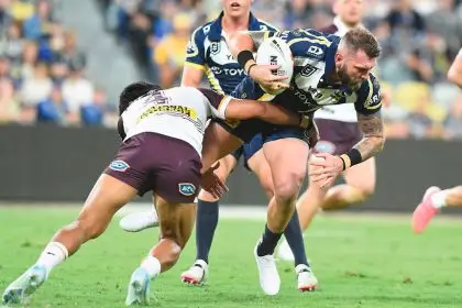 Kyle Feldt of the North Queensland Cowboys tries to muscle his way through the Brisbane Broncos at Queensland Country Bank Stadium in Townsville. PHOTO: AAP Image/Scott Radford-Chisholm