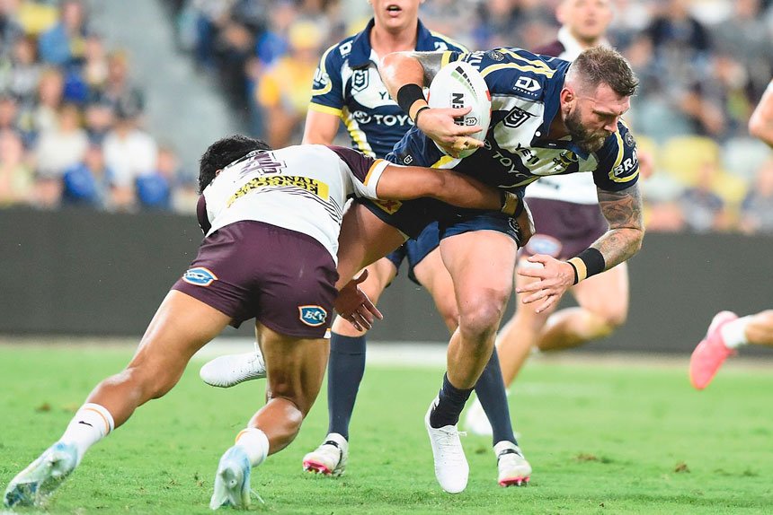 Kyle Feldt of the North Queensland Cowboys tries to muscle his way through the Brisbane Broncos at Queensland Country Bank Stadium in Townsville. PHOTO: AAP Image/Scott Radford-Chisholm