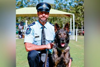 Police dog Kaos receives his Canine Service Medal.