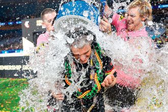 Penrith Panthers coach Ivan Cleary gets a celebratory dunking after his team won the NRL Grand Final over the Melbourne Storm. PHOTO: AAP Image/Mark Evans