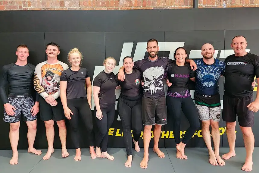 The Henrys with members of one of their jiu-jitsu classes.