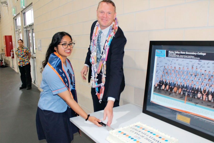 Christy Joseph & Principal Brendan Krueger.