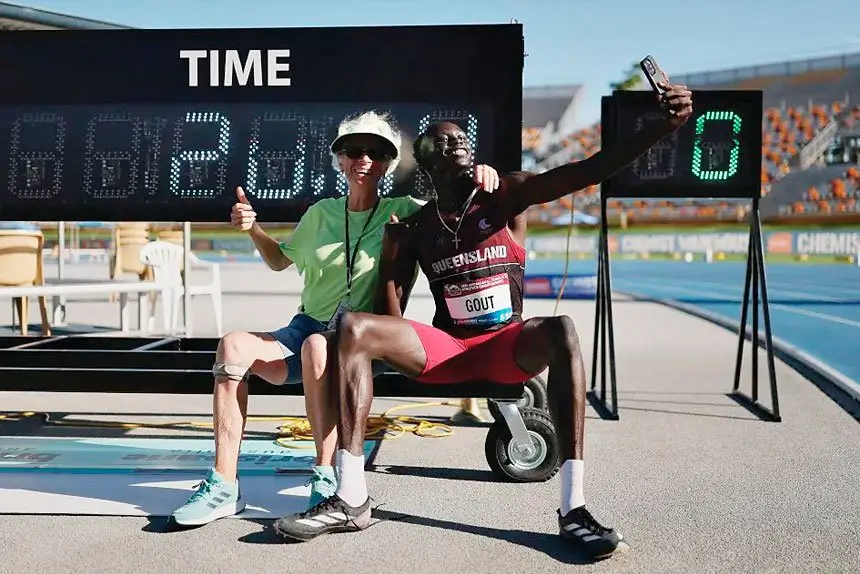 FAST LANE: Teen sensation Gout Gout with coach Diane Sheppard.