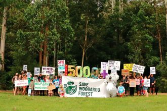 UNITED STAND: Save Woogaroo Forest members recently gathered at the site of the proposed development.