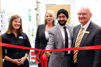 Cutting the ribbon at Ipswich Medicare Urgent Care Clinic last year