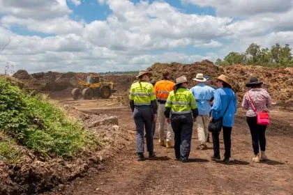 WALKING THE WALK: Dr John Gerrard and his Inquiry Panel Team inspect the landfill site at Swanbank.