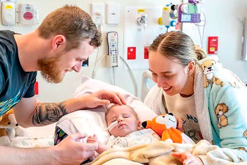 LITTLE BATTLER: Jenson with his parents Brianna Dalton and Jesse Carlile.