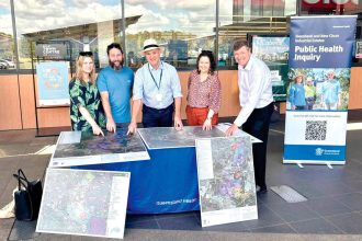 Public Health Inquiry Chair Dr John Gerrard meets with locals at a pop-up feedback session.