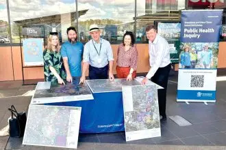 Public Health Inquiry Chair Dr John Gerrard meets with locals at a pop-up feedback session.