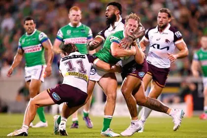 Zac Hosking is tackled by Payne Haas during the Canberr Raiders v Brisbane Broncos clash at GIO Stadium on Saturday. (AAP Image/Lukas Coch)