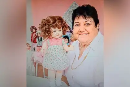 DOLL LOVER: Val Metcalfe with one of her many treasured dolls.