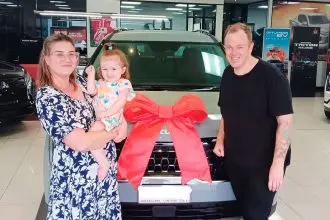 DRIVEN TO SUCCEED: Ava Tracey with mum and dad Rachel and Ben.