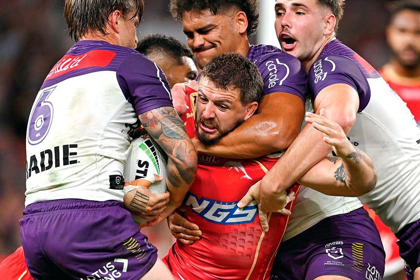 Dolphins forward Ray Stone is well held by the Storm defence. PHOTO: AAP Image/Dave Hunt