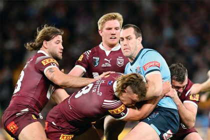Blues captain Isaah Yeo is tackled by Reuben Cotter during last year’s State of Origin. PHOTO: AAP Image/Darren England)
