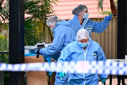 Forensic police gather evidence at a property in Springfield Lakes where a 23-year-old mother-of-two died on Friday night. PHOTO: AAP Image/Dave Hunt