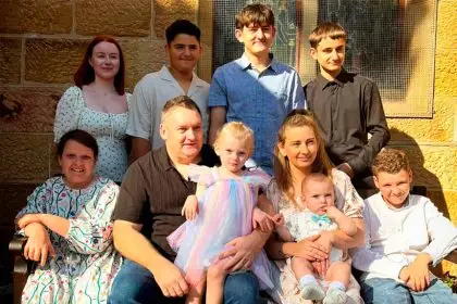 FULL HOUSE: Ipswich mum Lisa Catton with her husband Nathan and their eight children.