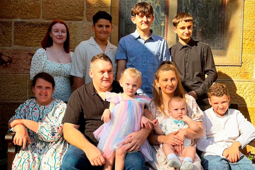 FULL HOUSE: Ipswich mum Lisa Catton with her husband Nathan and their eight children.