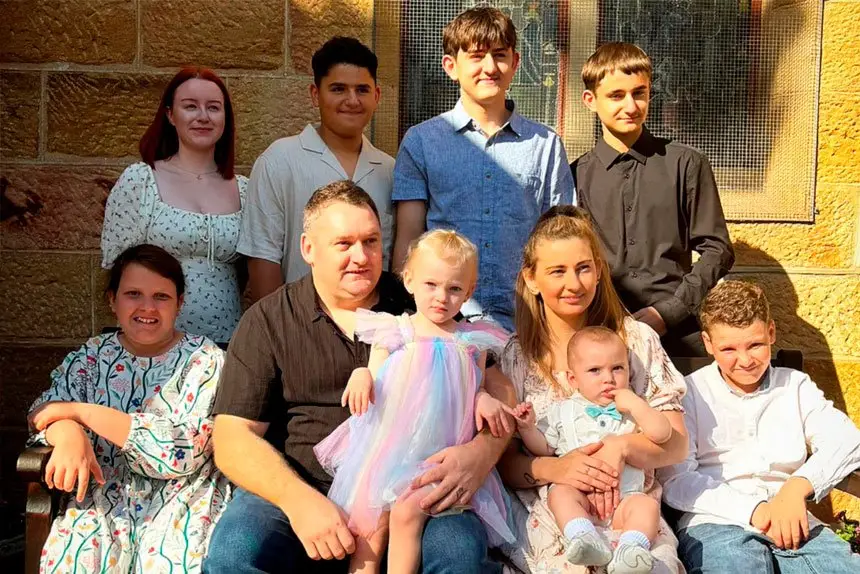 FULL HOUSE: Ipswich mum Lisa Catton with her husband Nathan and their eight children.