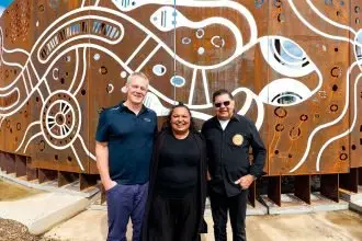 HONOURING CULTURE: Kylie Hill with Suntory Oceania’s Paul Woods and Uncle Eddie Ruska.
