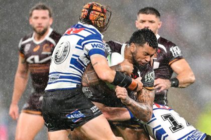 Xavier Willison of the Broncos is tackled during the NRL Round 8 match against the Bulldogs. PHOTO: AAP Image/Dave Hunt