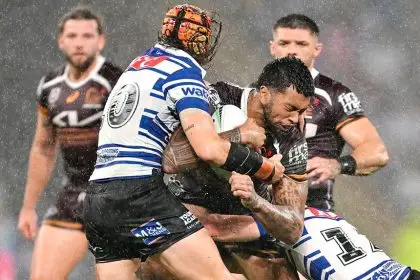 Xavier Willison of the Broncos is tackled during the NRL Round 8 match against the Bulldogs. PHOTO: AAP Image/Dave Hunt