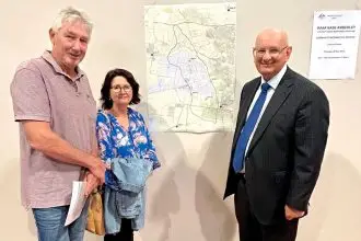 Federal Member for Blair Shayne Neumann with Karrabin residents Annette and Steve Platzer at the Department of Defence community information session.
