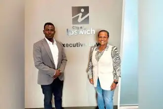 Queensland African Communities Council President Faysel Ahmed Salet with Cr Pye Augustine.