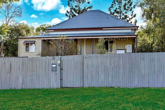 LOTS TO LIKE: High ceilings and timber flooring are just two of the many alluring aspects of this North Ipswich home.
