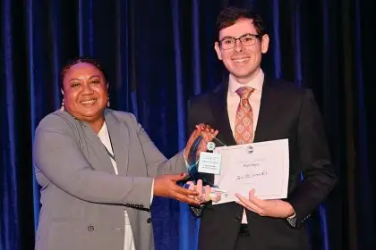 PROUD MOMENT: Ben McCormick receives his award.