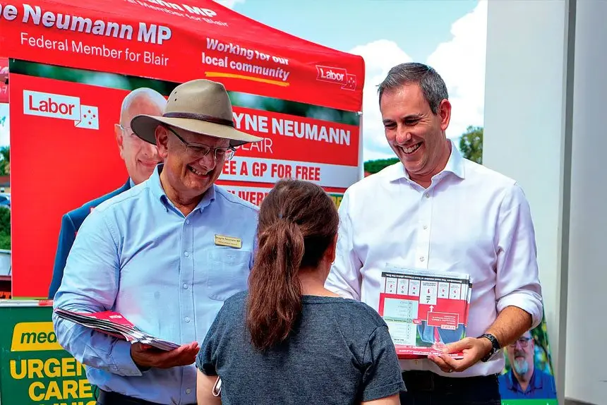 Federal Member for Blair Shayne Neumann and Treasurer Jim Chalmers speak with voters at a polling booth in Blair during the May election.