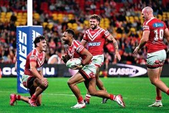 Hamiso Tabuai-Fidow of the Dolphins scores his second of four tries during the NRL Round 17 match between the Dolphins and the Rabbitohs. PHOTO: AAP Image/Dave Hunt