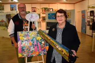 ArtsConnect Ipswich President Glen Smith and Silkstone artist Denise Taylor at the ArtsConnect Community Gallery at Booval Fair.