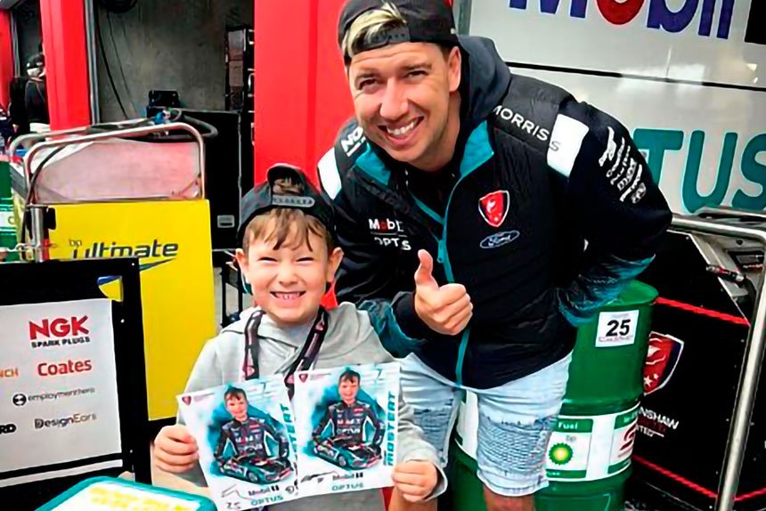 DREAM DAY: Young motorsport fan Ezra Woodforth with his Supercars hero Chaz Mostert.