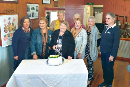 Branch members gather for the milestone occasion.