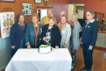 Branch members gather for the milestone occasion.