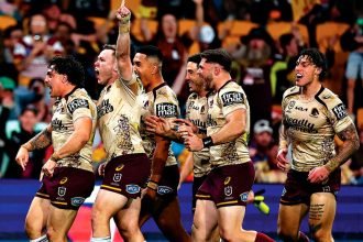 The Broncos celebrate a Kotoni Staggs try against the Dolphins. PHOTO: AAP Image/Pat Hoelscher