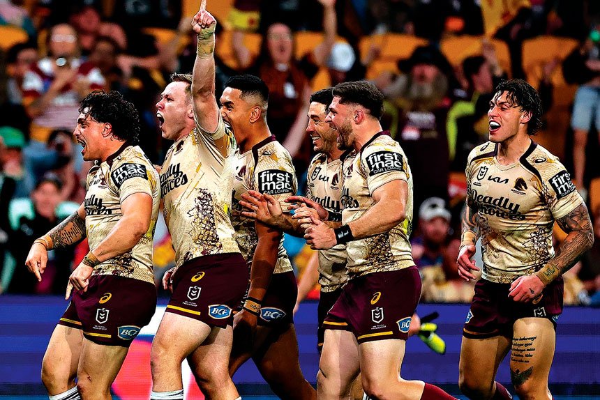 The Broncos celebrate a Kotoni Staggs try against the Dolphins. PHOTO: AAP Image/Pat Hoelscher