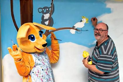 Arts Connect Ipswich President Glen Smith is joined by Buddy the Booval Fair Kangaroo to promote the community mural project.