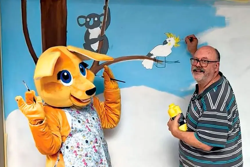 Arts Connect Ipswich President Glen Smith is joined by Buddy the Booval Fair Kangaroo to promote the community mural project.