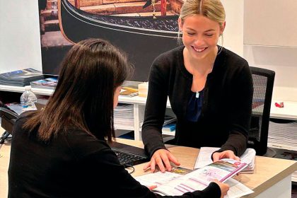 Mia Templey helping a client.